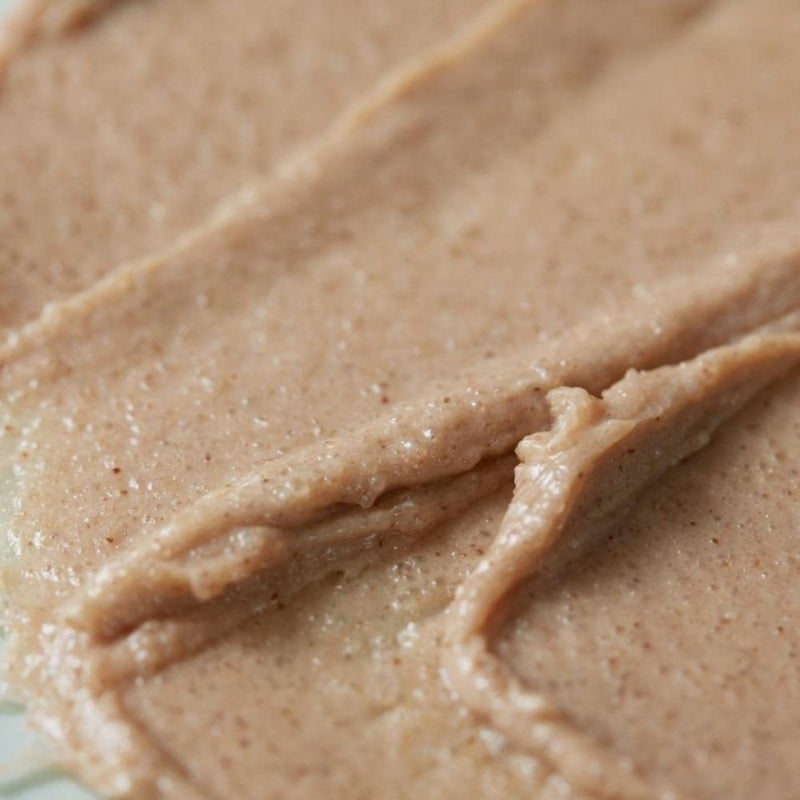 Beige sea salt scalp scrub paste texture in tight close-up