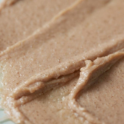 Beige sea salt scalp scrub paste texture in tight close-up