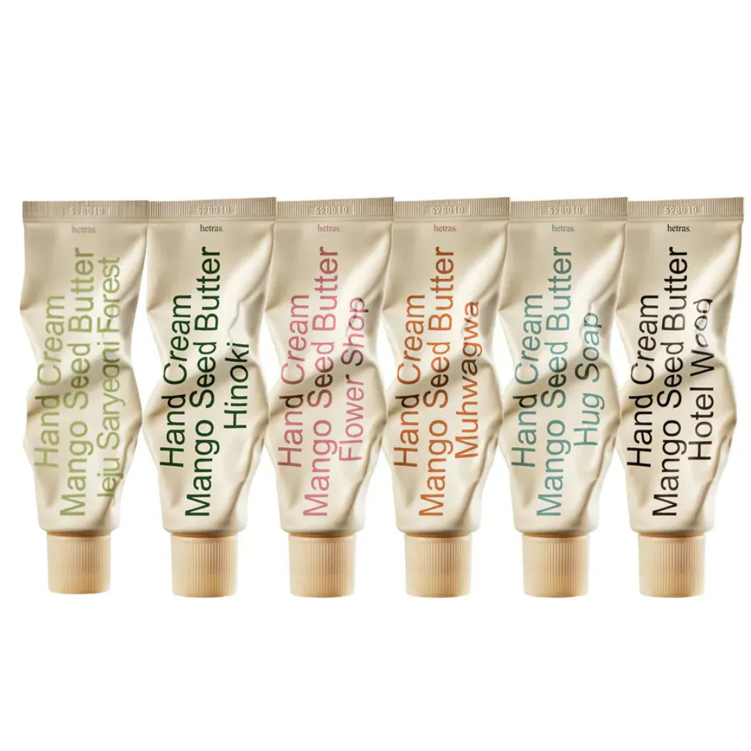 Mango seed perfumed hand cream tubes, multiple gold tubes with beige caps in a row