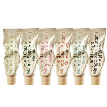Mango seed perfumed hand cream tubes, multiple gold tubes with beige caps in a row