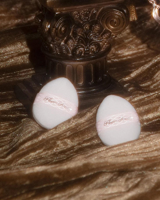 Mini powder puffs (2), round white sponges with pink FlowerKnows logo