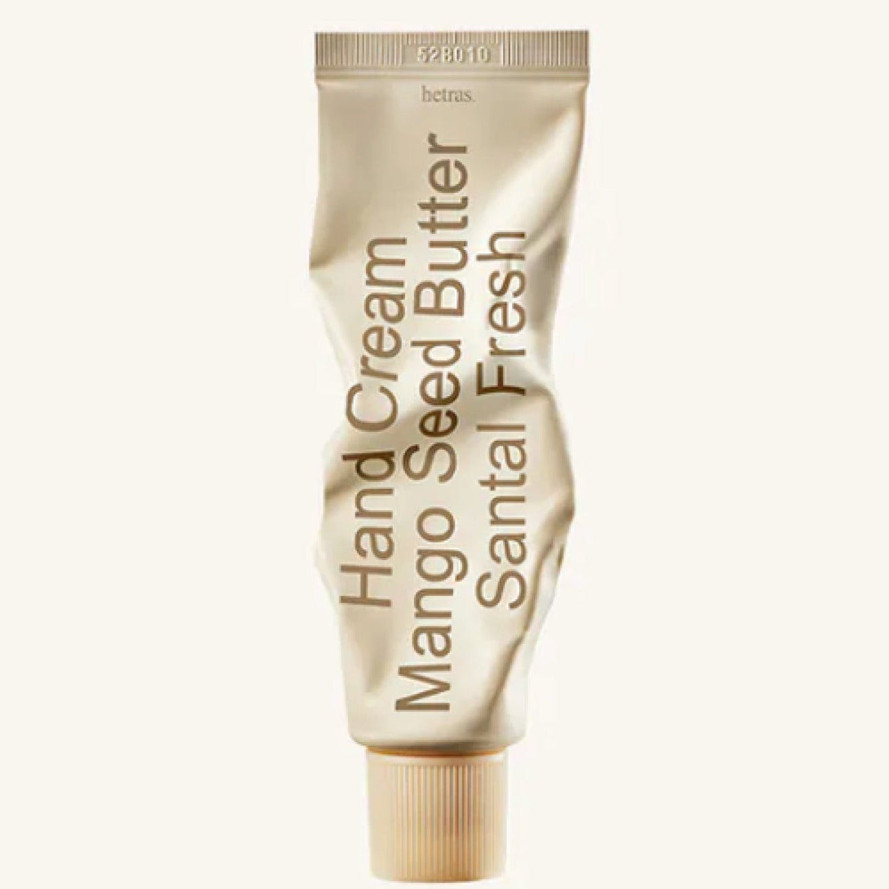 Gold mango seed hand cream tube with vertical label, Hand Cream and Santal Fresh