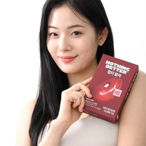 Nothing Better Luv Tea cleanse tea box held by a woman, front label visible