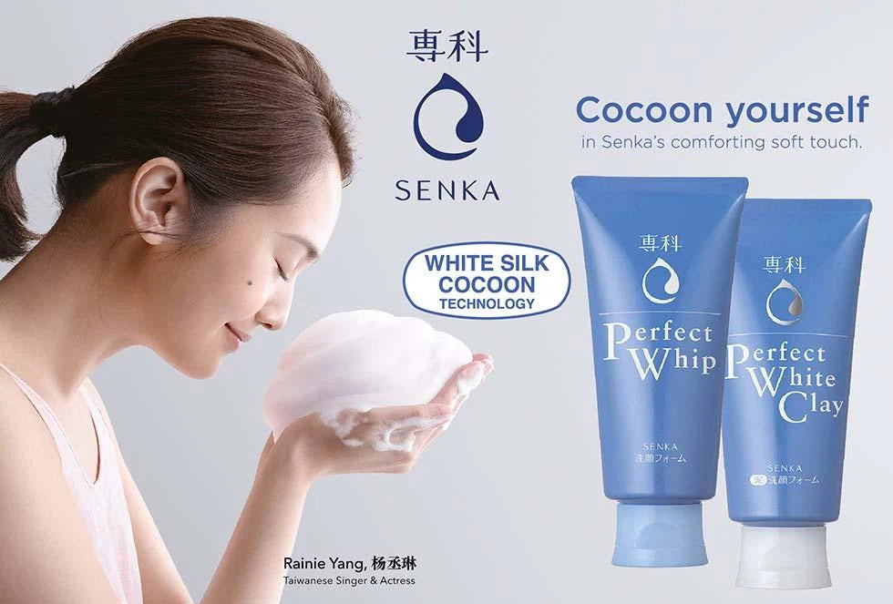 Senka skincare tubes with a woman washing her face, blue-and-white packaging