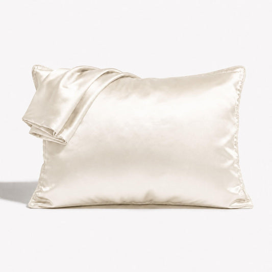 Ivory satin pillowcase with stitched border and folded corner detail