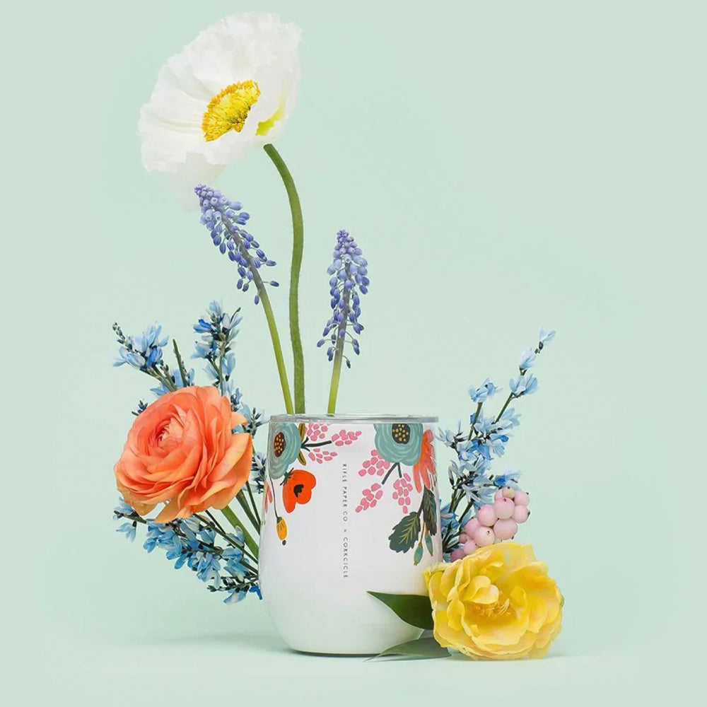 Cream stemless tumbler with Rifle Paper floral artwork and stainless rim