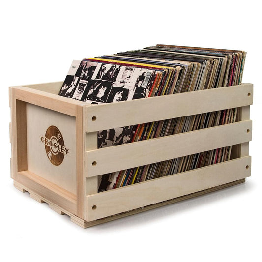 Wooden record storage crate filled with stacked vinyl records
