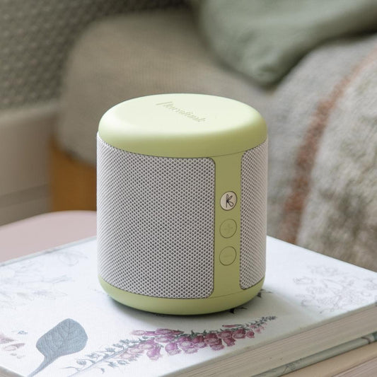 Dusty olive Bluetooth speaker with gray fabric mesh grille and top control panel