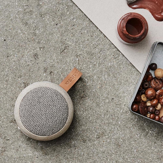 Kreafunk Ago 2 fabric Bluetooth speaker with circular grille and brown strap