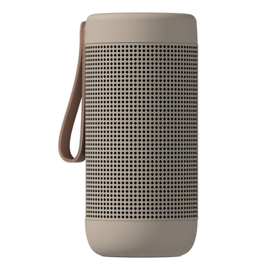 Ivory sand Bluetooth speaker with perforated grille and leather wrist strap