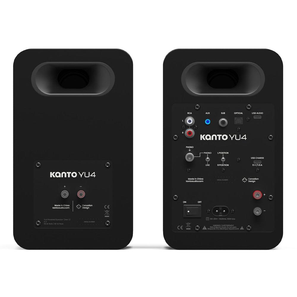 Two matte black Kanto YU4 powered bookshelf speakers with rear connection panels