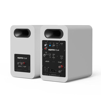 Matte white powered bookshelf speakers, rear panel ports and connection panel visible.