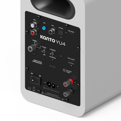 Matte white speaker rear input panel with RCA, optical, and USB-C connections.