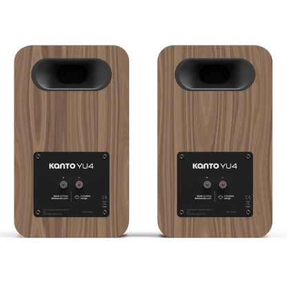 Matte walnut powered bookshelf speakers, front view with control panel and port labels