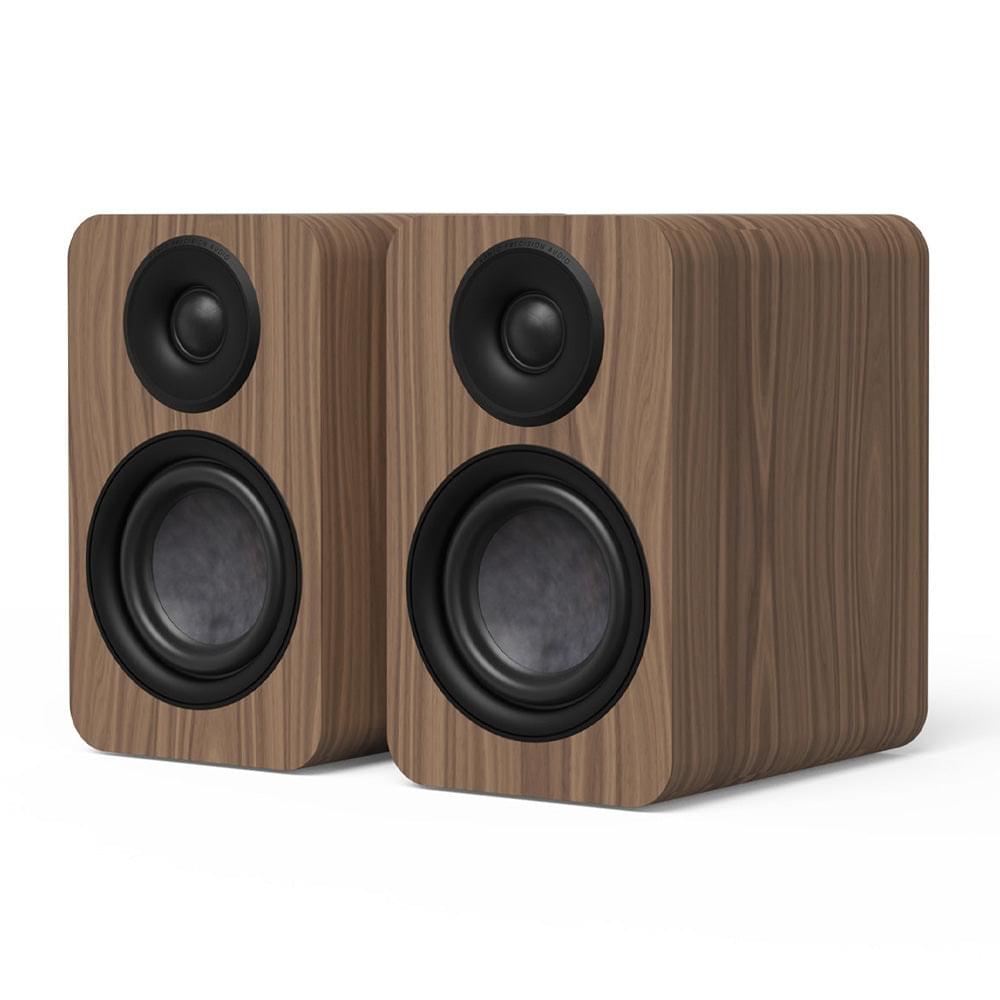 Matte walnut powered bookshelf speaker pair with two front black woofers and tweeters