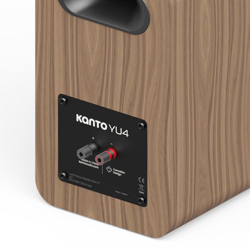Matte walnut powered bookshelf speaker back panel with input ports and controls