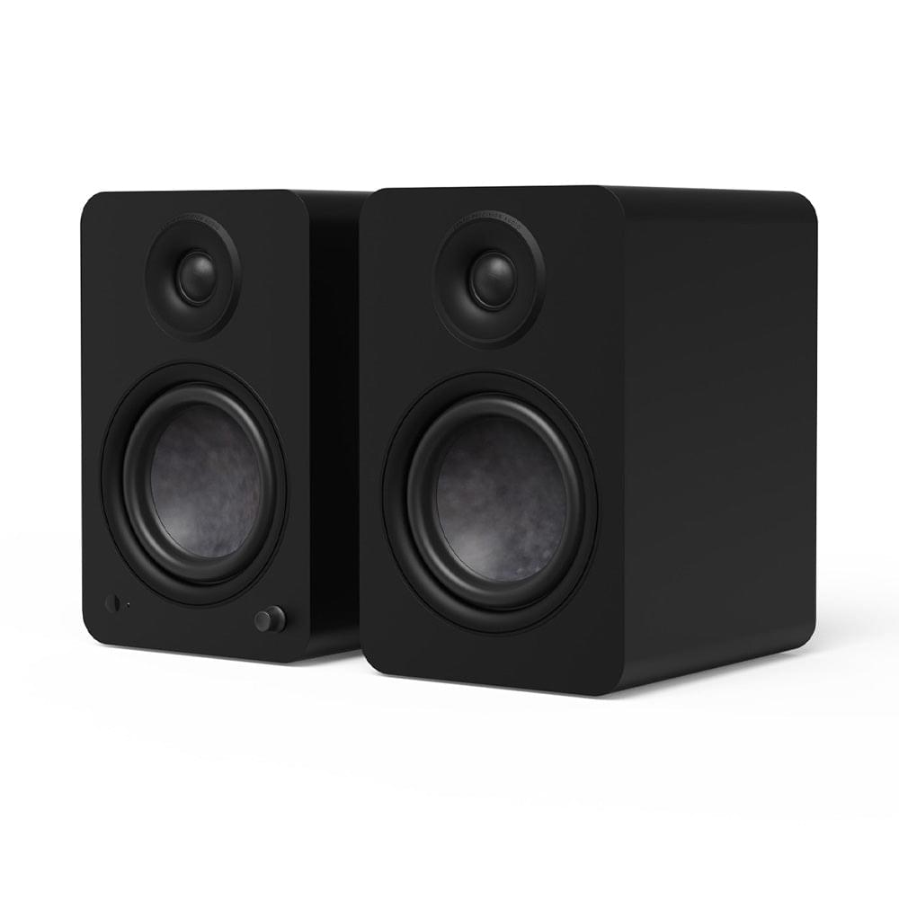 Matte black powered bookshelf speakers pair, front tweeter and woofer details