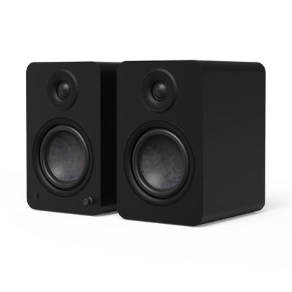 Matte black powered bookshelf speakers pair, front tweeter and woofer details