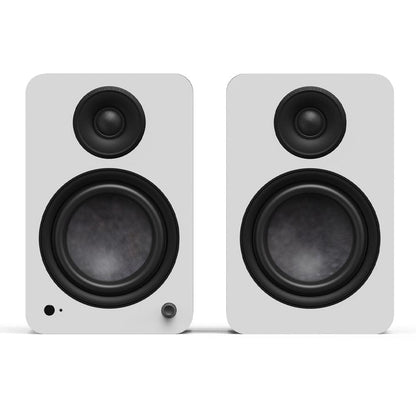 Matte white powered bookshelf speakers, black tweeters and woofers, front view pair