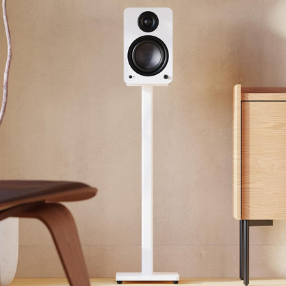 Matte white powered bookshelf speaker with black tweeter and woofer, on floor stand