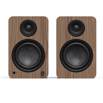 Matte walnut powered bookshelf speaker pair with dual woofers and tweeters