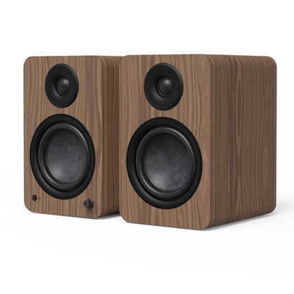 Matte walnut powered bookshelf speaker pair with two front woofers and tweeters