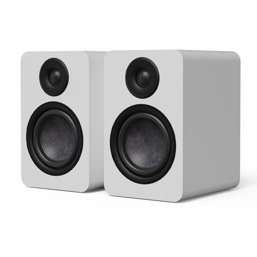 Matte white passive bookshelf speaker pair angled view with black tweeters and woofers