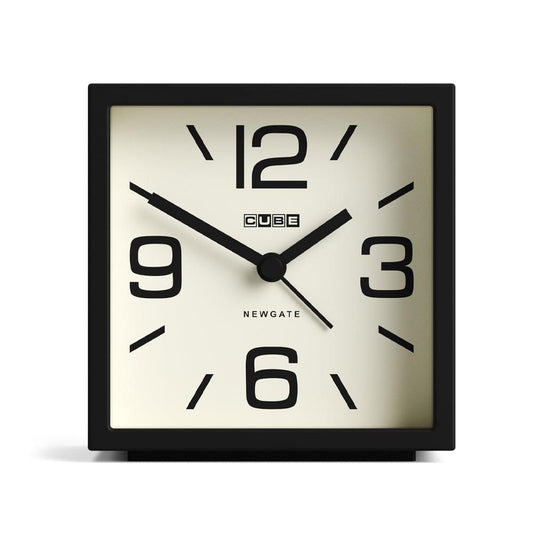 Black cube mantel clock with cream face, large 12 and 6 numerals, black hands.