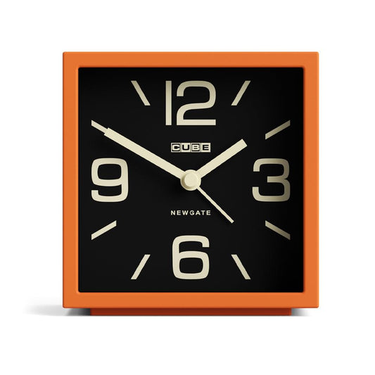 Pumpkin orange cube mantel clock with black dial and gold numerals 12, 3, 6, 9