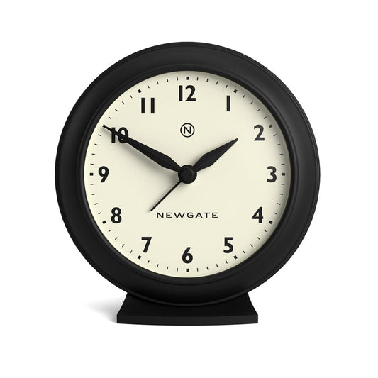 Black mantel clock with round bezel, cream dial, black hands and base, Newgate logo