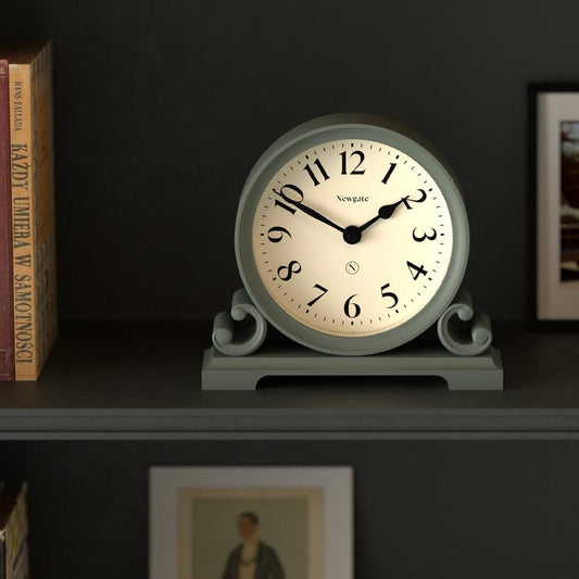 Asparagus green mantel clock with white dial, Roman numerals, and black hands