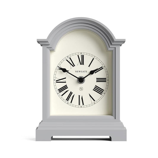 Grey mantel clock with arched frame, Roman numeral face and black hour/minute hands