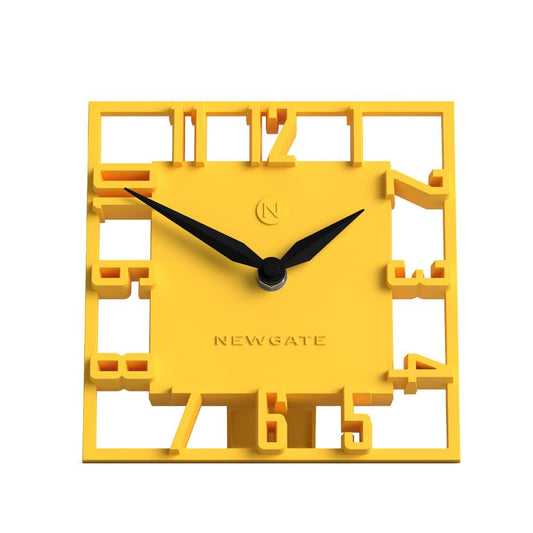 Yellow square mantel clock with black hands and raised Roman numerals, NEWGATE logo