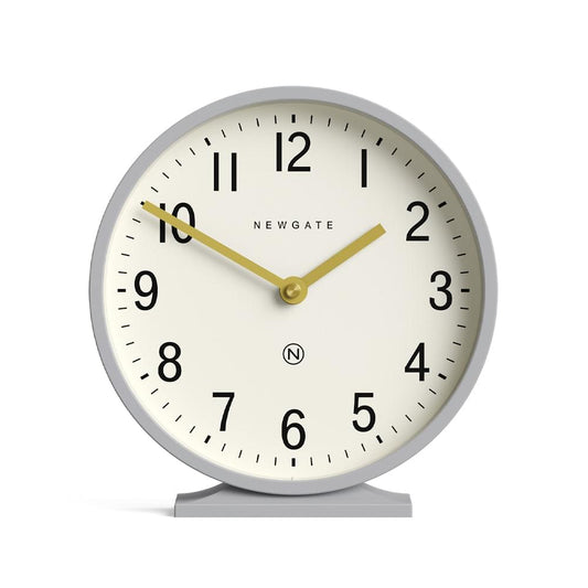 Front view grey mantel clock; cream dial with Newgate text, black numerals, gold hands