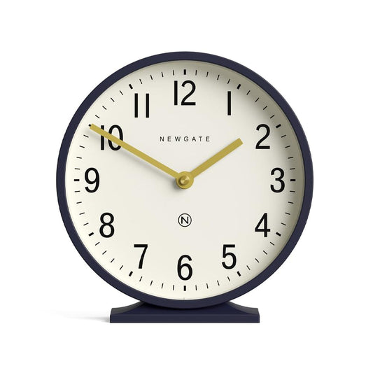 Petrol blue mantel clock with cream dial, gold hands, and circular navy frame