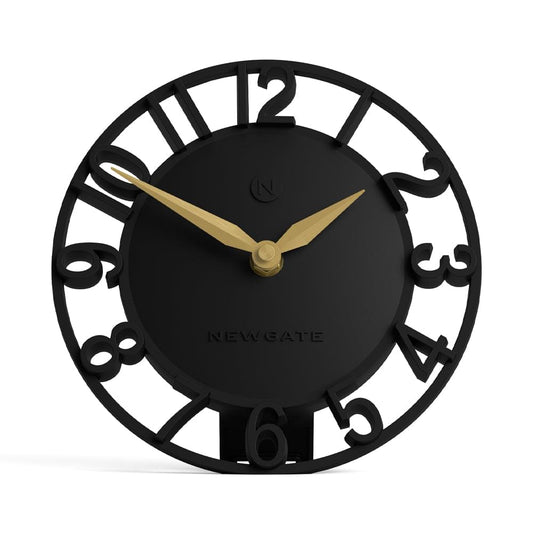 Newgate black mantel clock close-up, gold hands and Roman-style numeral ring