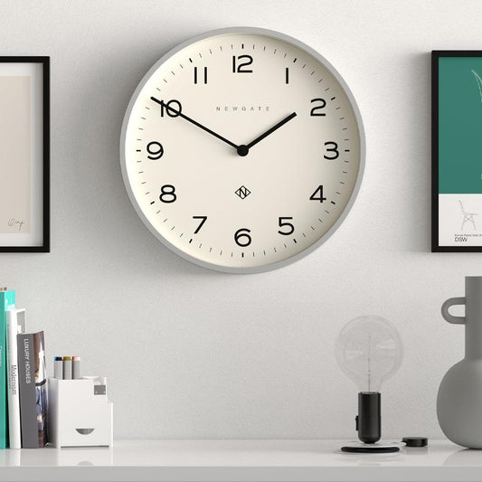 Grey round wall clock with cream face, black hands and hour markers