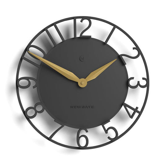 Grey round wall clock with gold hands, dark dial, and metal outer ring number markers