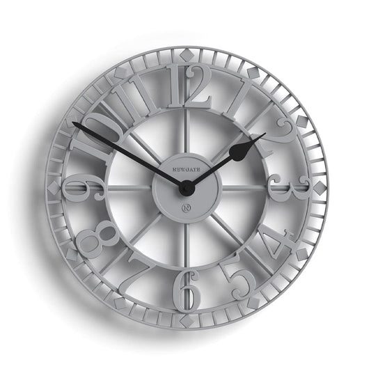 Grey clock with raised Roman numeral ring, decorative flourishes, and central hub