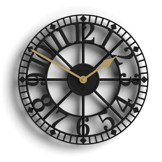 Black round wall clock with Roman-style numerals and gold-tone hands