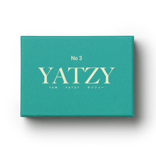 Teal Yatzy game box with YATZY branding and No 3 label