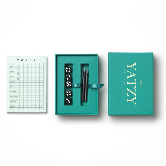 Yatzy game set with score sheet, dice, pencils, and teal case