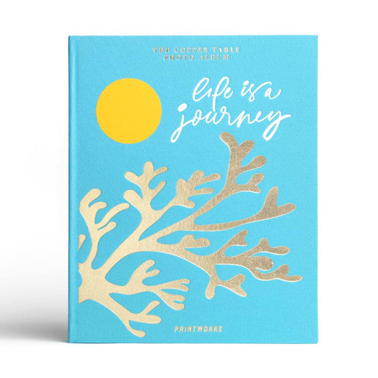 Turquoise photo album with yellow sun and beige coral-tree illustration