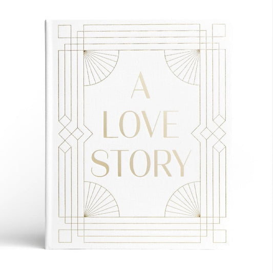 Wedding photo album with white cover and gold “A LOVE STORY” title