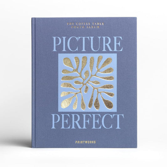 Blue hardcover photo album with gold “Picture Perfect” title and decorative tree print