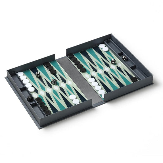 Open backgammon set with teal-and-white patterned board and black/white pieces