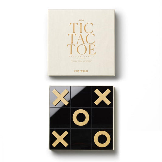 Classic tic tac toe board set in open box with X and O pieces