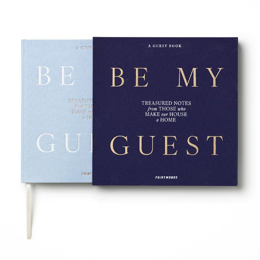 Set of two guest books: light blue and dark blue covers with gold 'BE MY GUEST'