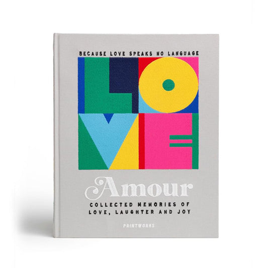 Embroidered photo album with Amour title and colorful geometric blocks on cover.
