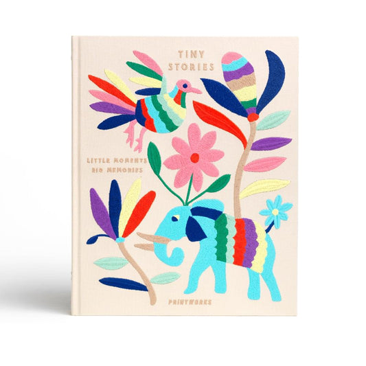 Tiny Stories photo album with colorful illustrated animal and flower cover